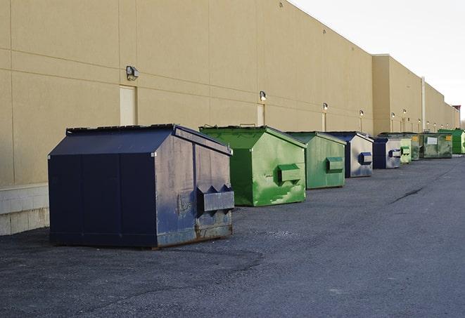 red and green waste bins at a building project in Dacula